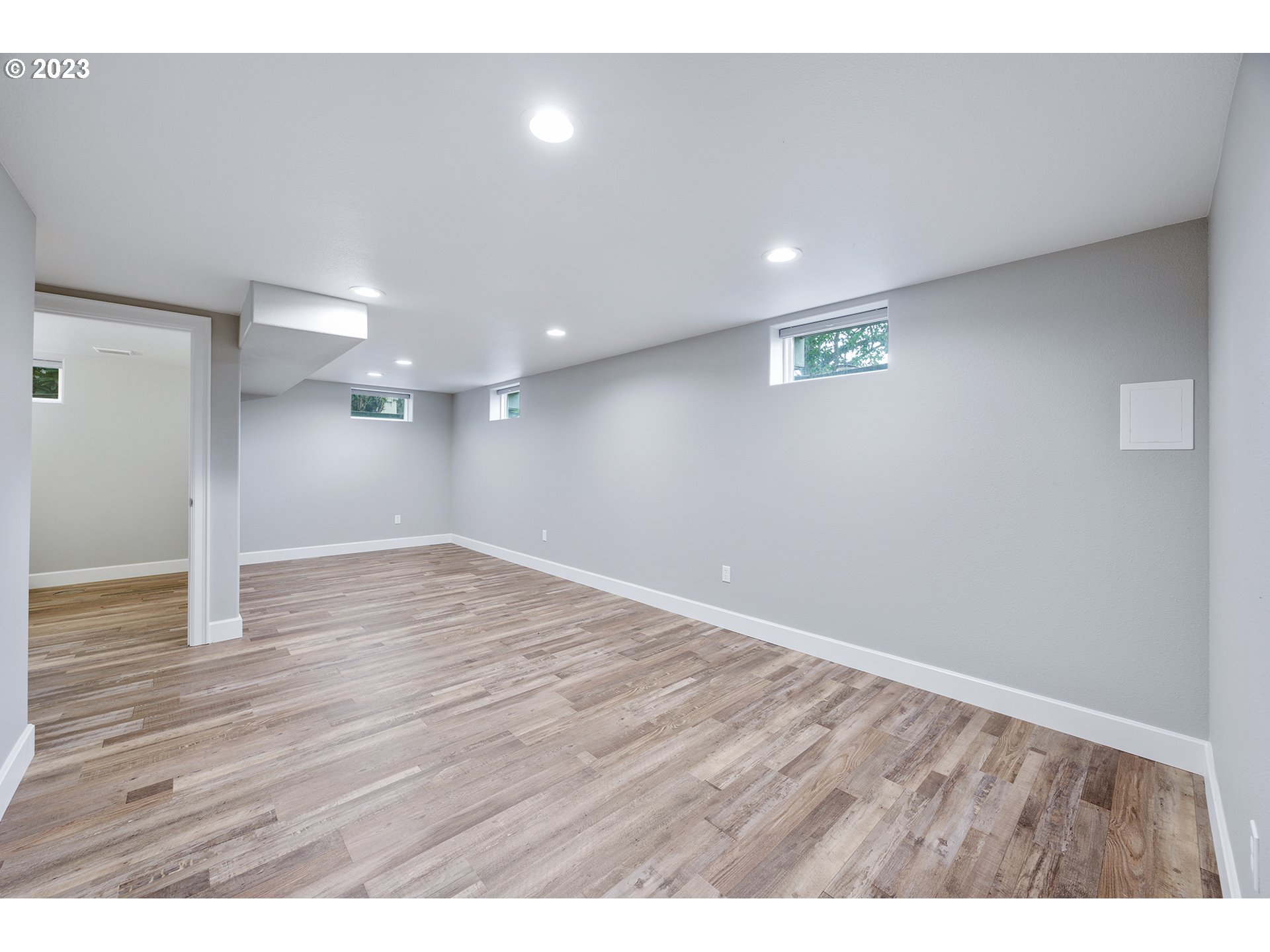 1427 Southeast 109th Avenue Portland, OR 97216 - Photo 31 of 44 a view of an empty room with wooden floor