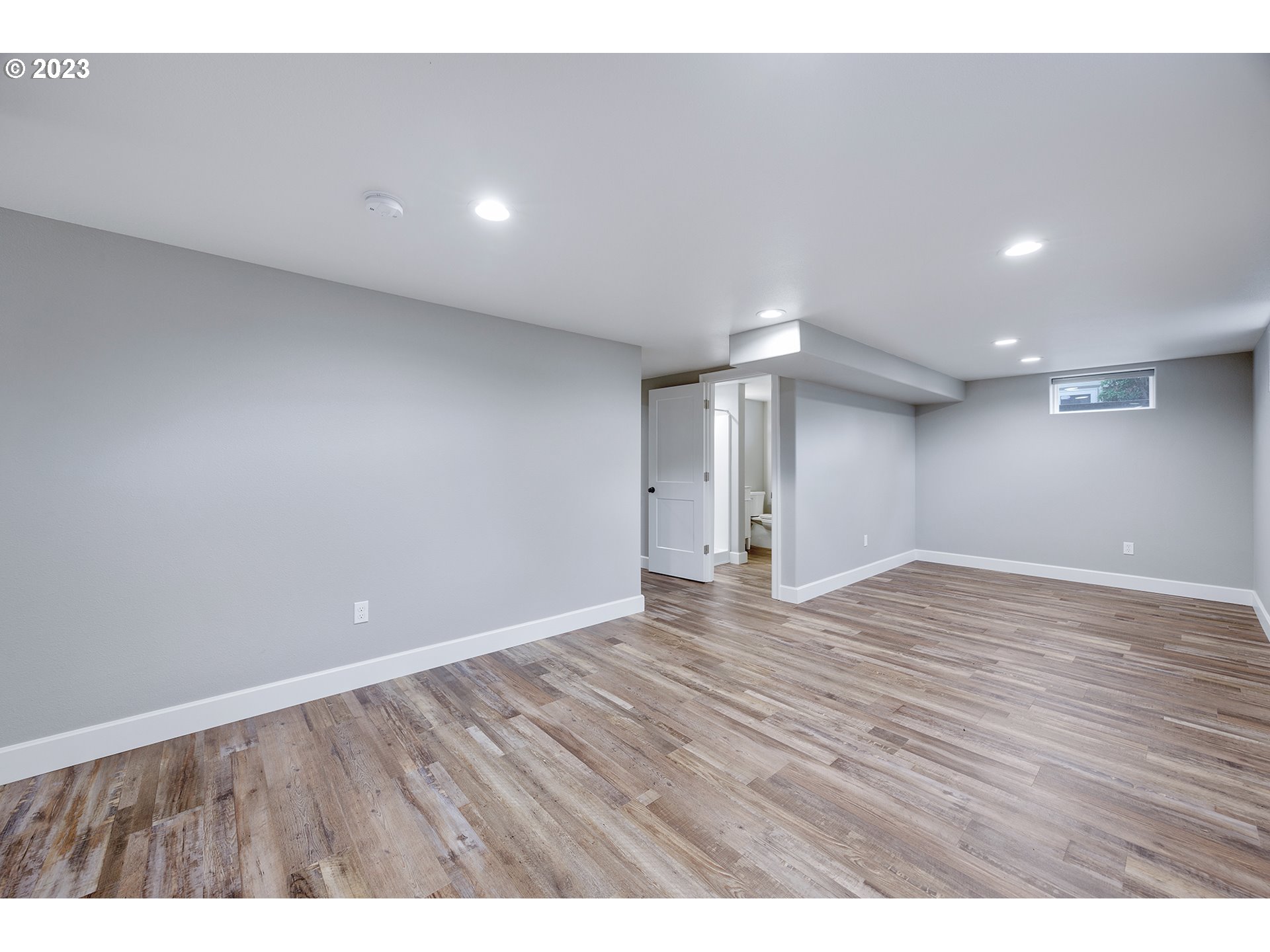 1427 Southeast 109th Avenue Portland, OR 97216 - Photo 32 of 44 a view of an empty room with wooden floor