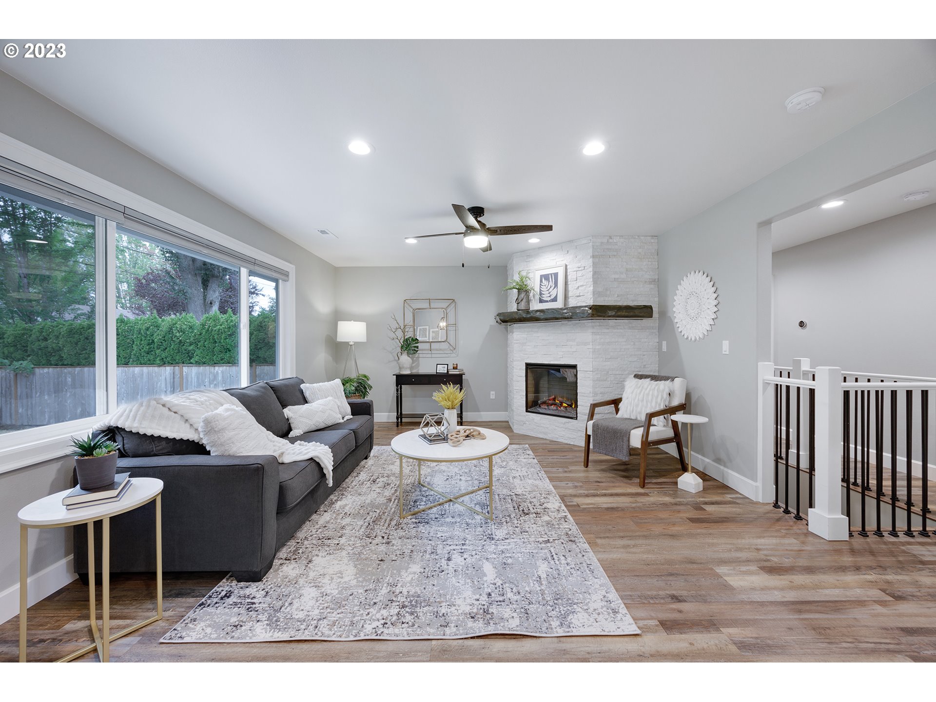 1427 Southeast 109th Avenue Portland, OR 97216 - Photo 8 of 44 a living room with furniture a fireplace and a table