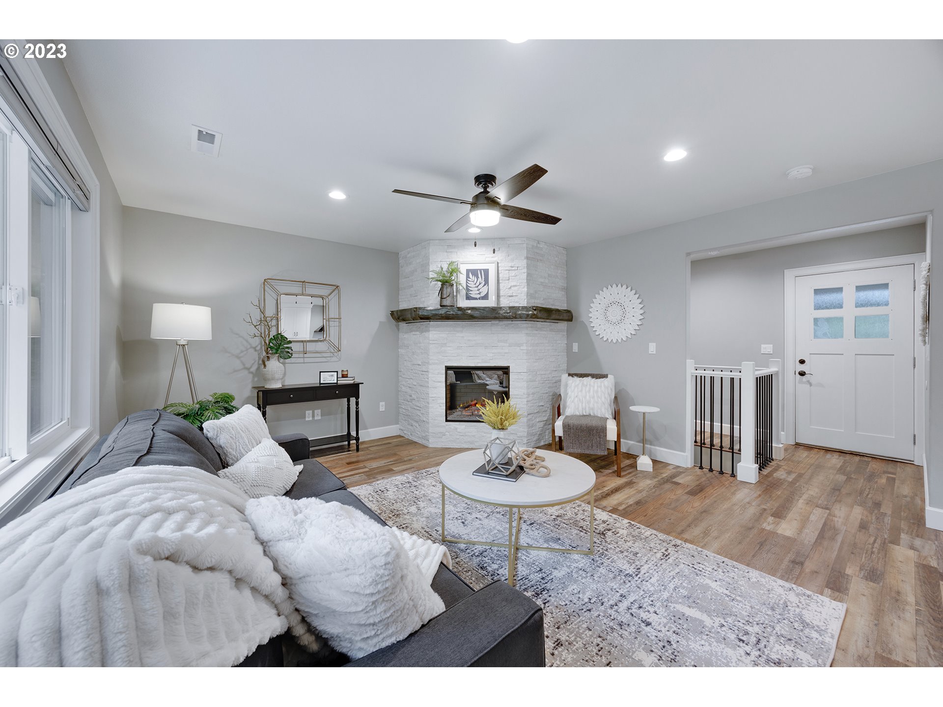 1427 Southeast 109th Avenue Portland, OR 97216 - Photo 9 of 44 a living room with furniture a fireplace and a table