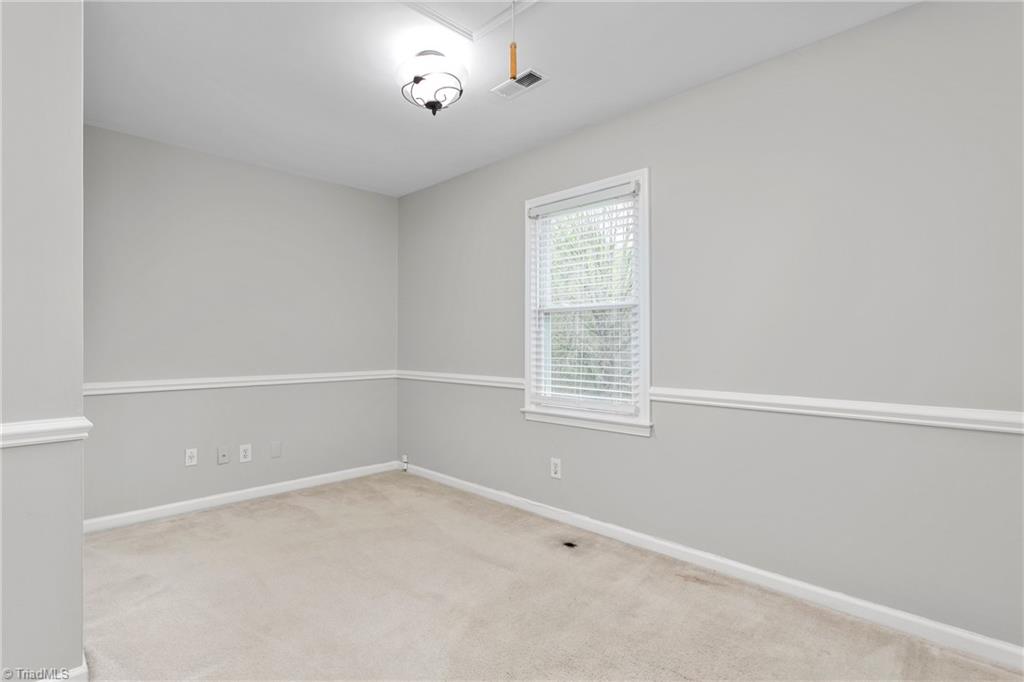 3103 Spring Mill Road Greensboro, NC 27406 - Photo 28 of 44 Second bedroom has a nice closet and pond views as well