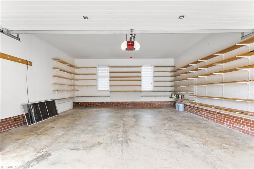 3103 Spring Mill Road Greensboro, NC 27406 - Photo 35 of 44 Spacious garage equipped with shelves