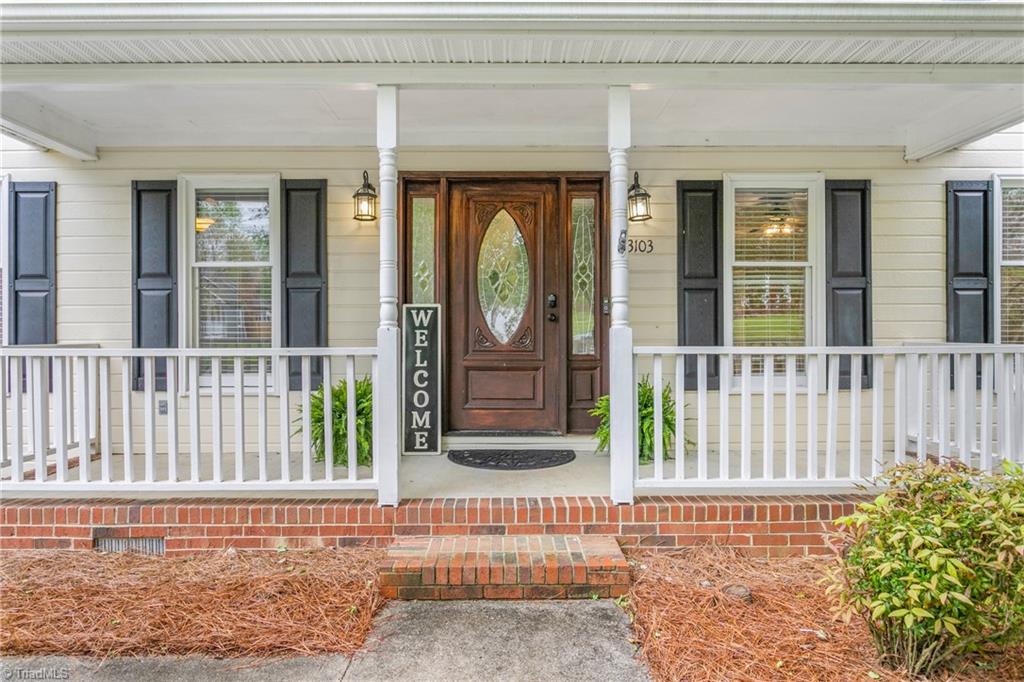 3103 Spring Mill Road Greensboro, NC 27406 - Photo 4 of 44 Classic Southern rocking chair front porch