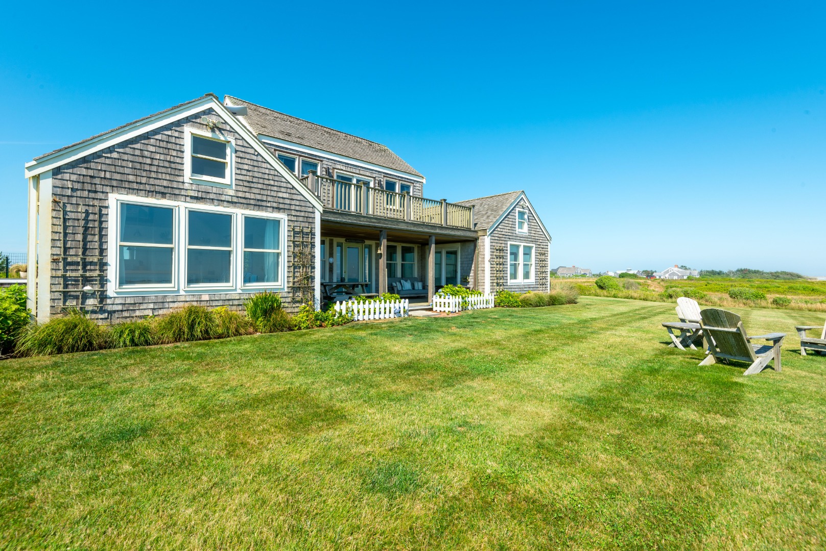 56 R Madequecham Valley Road Nantucket, MA 02554 - Photo 7 of 52 a front view of a house with a yard