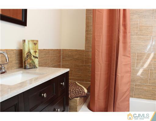 33 Meckes Street Springfield, NJ 07081 - Photo 15 of 25 a bathroom with a sink and a mirror