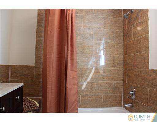 33 Meckes Street Springfield, NJ 07081 - Photo 16 of 25 a bathroom with a sink and a shower