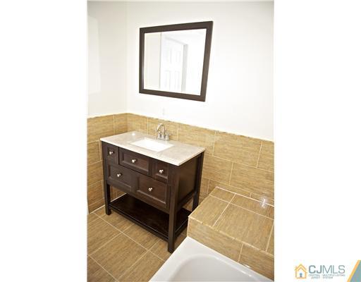 33 Meckes Street Springfield, NJ 07081 - Photo 17 of 25 a bathroom with a sink and a mirror