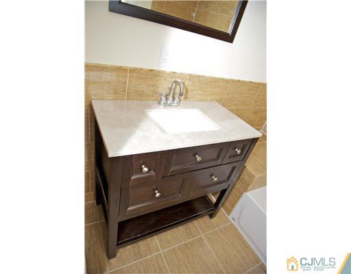 33 Meckes Street Springfield, NJ 07081 - Photo 18 of 25 a bathroom with a sink and a mirror
