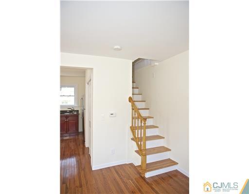 33 Meckes Street Springfield, NJ 07081 - Photo 19 of 25 a view of a room with stairs and wooden floor