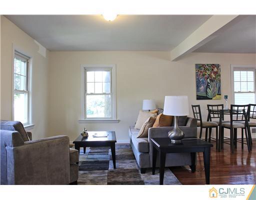 33 Meckes Street Springfield, NJ 07081 - Photo 5 of 25 a living room with furniture a window and a dining table