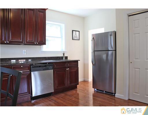 33 Meckes Street Springfield, NJ 07081 - Photo 9 of 25 a kitchen with a refrigerator and a sink