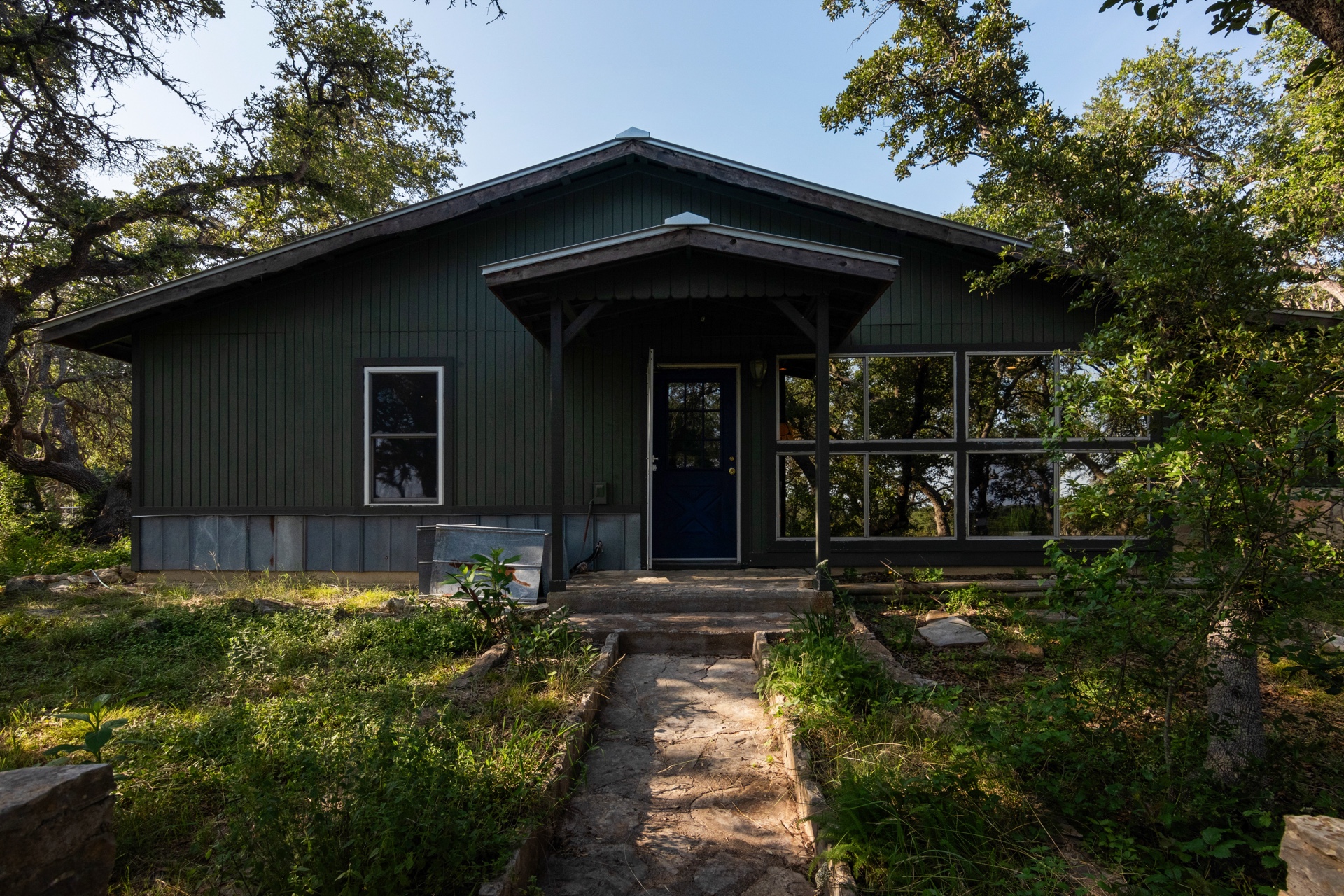 435 Spangenberg Road Blanco, TX 78606 - Photo 2 of 38 a front view of a house with balcony