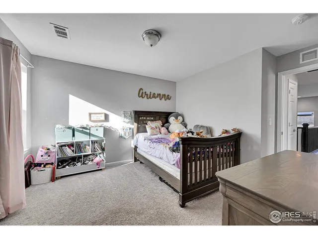 a view of a hallway with a livingroom with furniture
