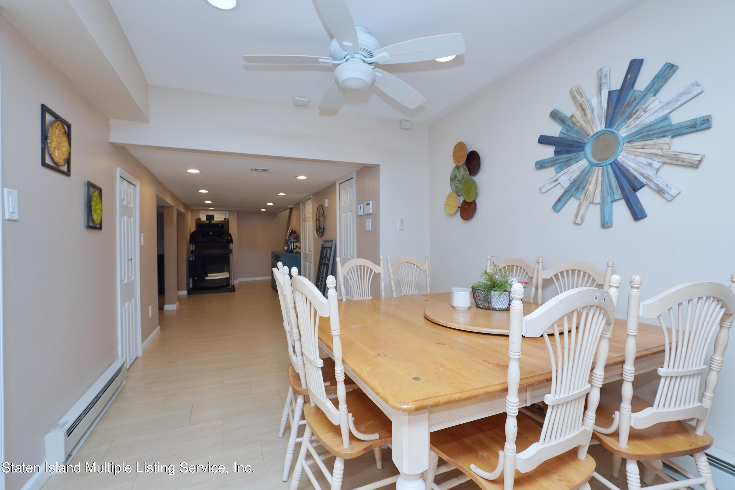72 Middle Loop Road Staten Island, NY 10308 - Photo 12 of 38 a dining room with furniture and window
