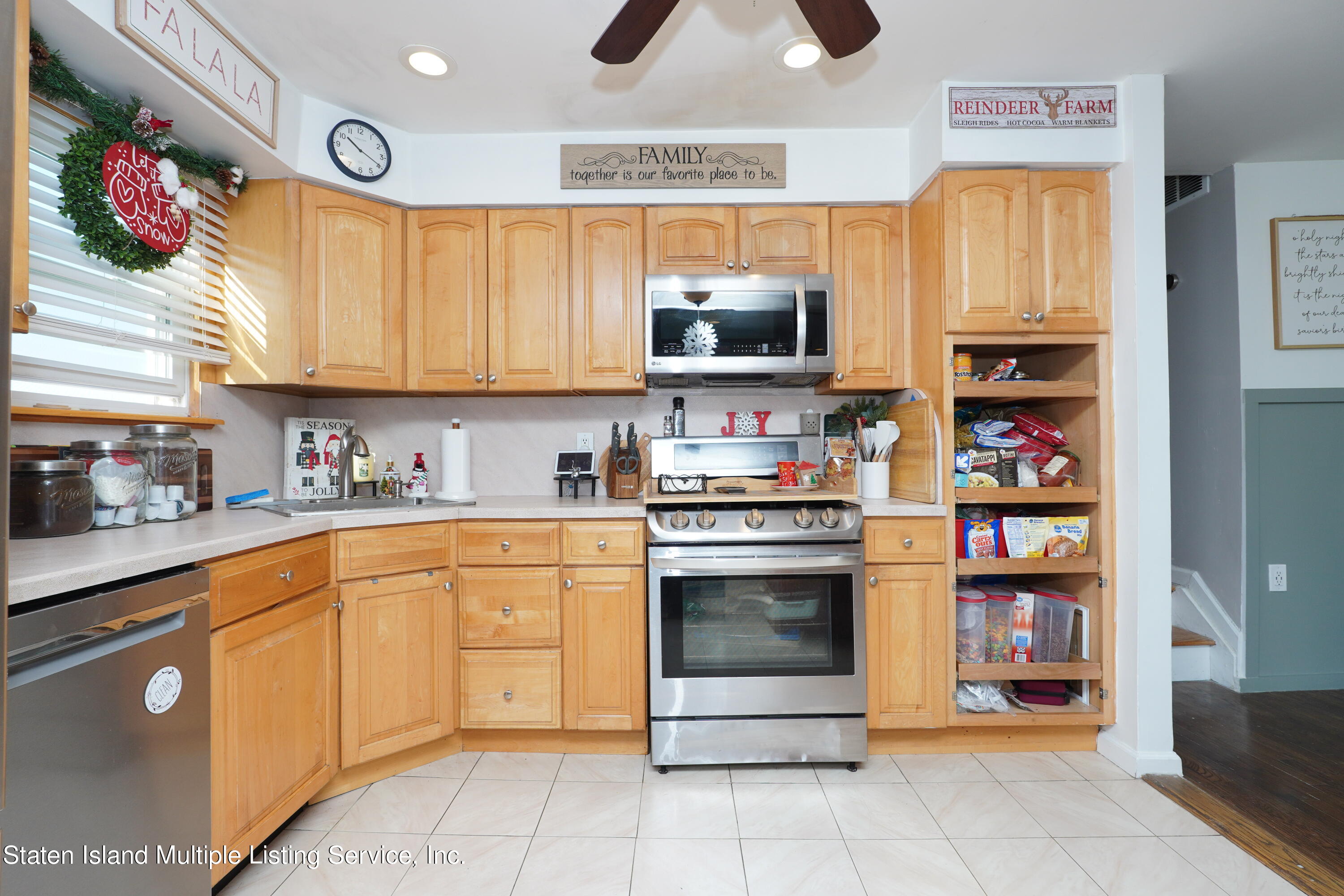 72 Middle Loop Road Staten Island, NY 10308 - Photo 23 of 38 a kitchen with stainless steel appliances granite countertop a stove and a sink