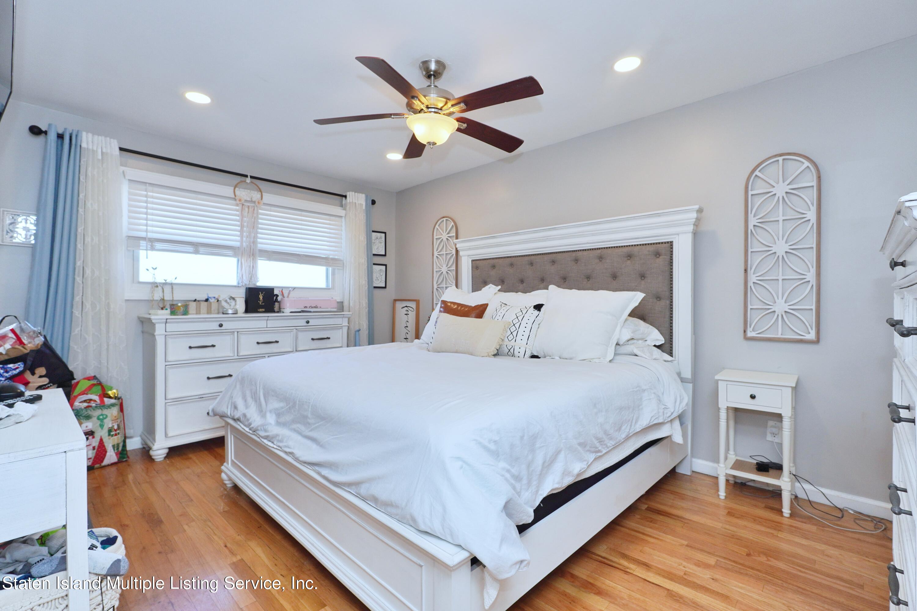 72 Middle Loop Road Staten Island, NY 10308 - Photo 34 of 38 a bed room with a bed and a window
