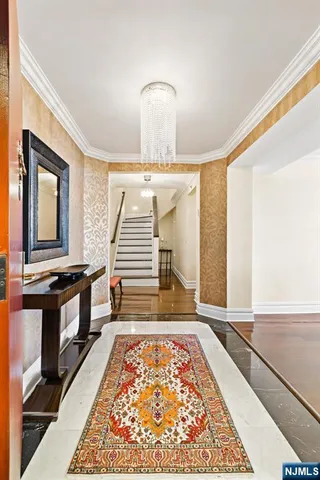 a view of an entryway with wooden floor