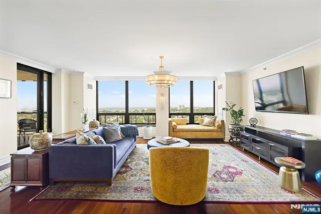 a living room with furniture fireplace and a flat screen tv