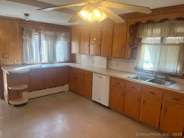 a kitchen with sink and window
