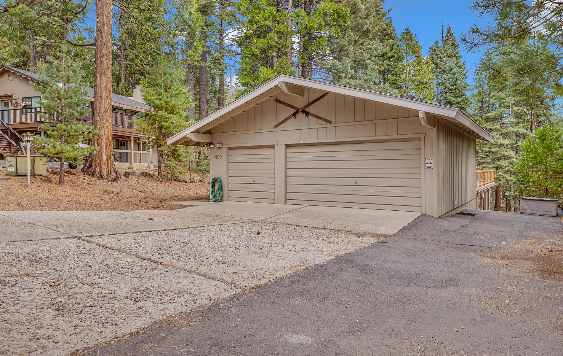 608 East Burnt Cedar Road Lake Almanor, CA 96137 - Photo 2 of 36 a view of a house with a yard and garage