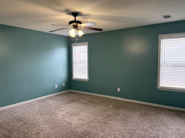 80 Whispering Ridge Cove Oakland, TN 38060 - Photo 7 of 13 en empty room with windows and chandelier fan
