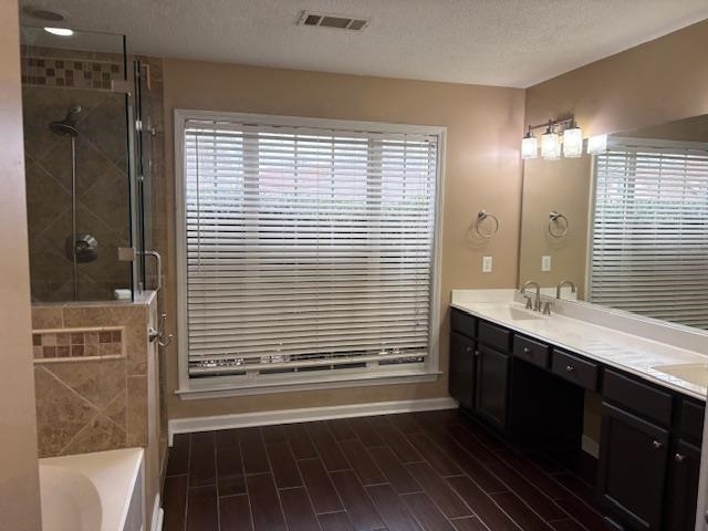 80 Whispering Ridge Cove Oakland, TN 38060 - Photo 8 of 13 a bathroom with a double vanity sink a large mirror and shower