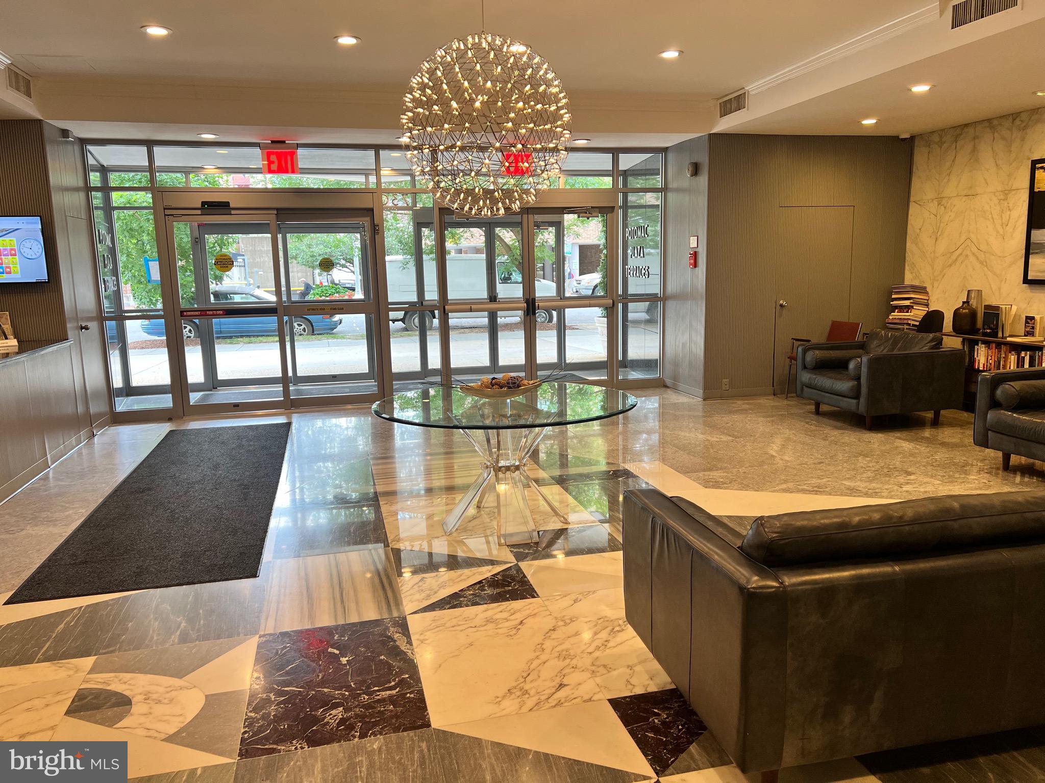 730 24th Street Northwest, Unit 703 Washington, DC 20037 - Photo 4 of 10 a living room with furniture large window and flat screen tv