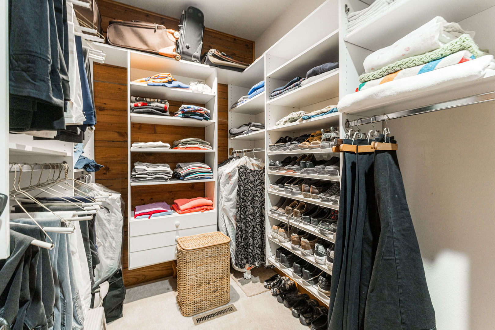 4060 Old State Road Kirkland, IL 60146 - Photo 17 of 51 a view of walk in closet with clothes and shoes
