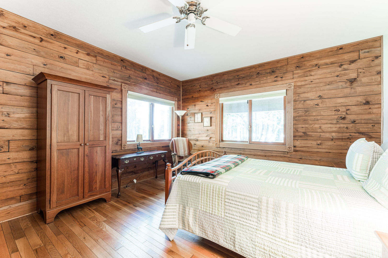 4060 Old State Road Kirkland, IL 60146 - Photo 21 of 51 a bedroom with a bed and a chandelier