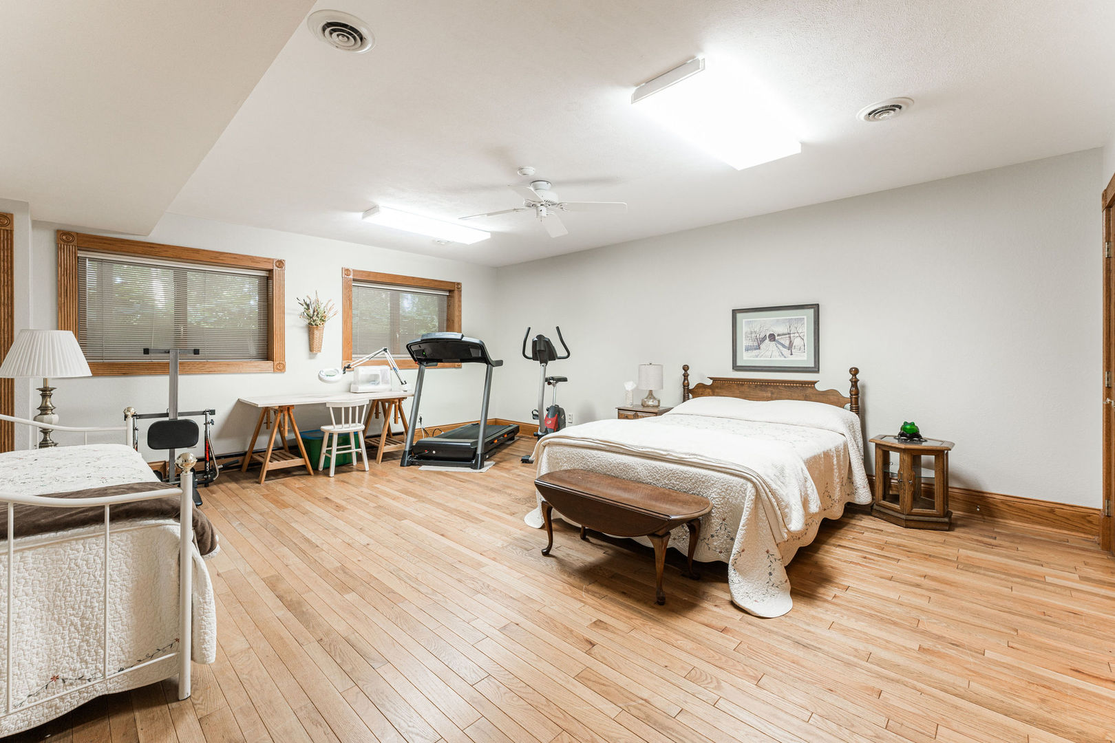 4060 Old State Road Kirkland, IL 60146 - Photo 27 of 51 a spacious bedroom with a bed a table and chair