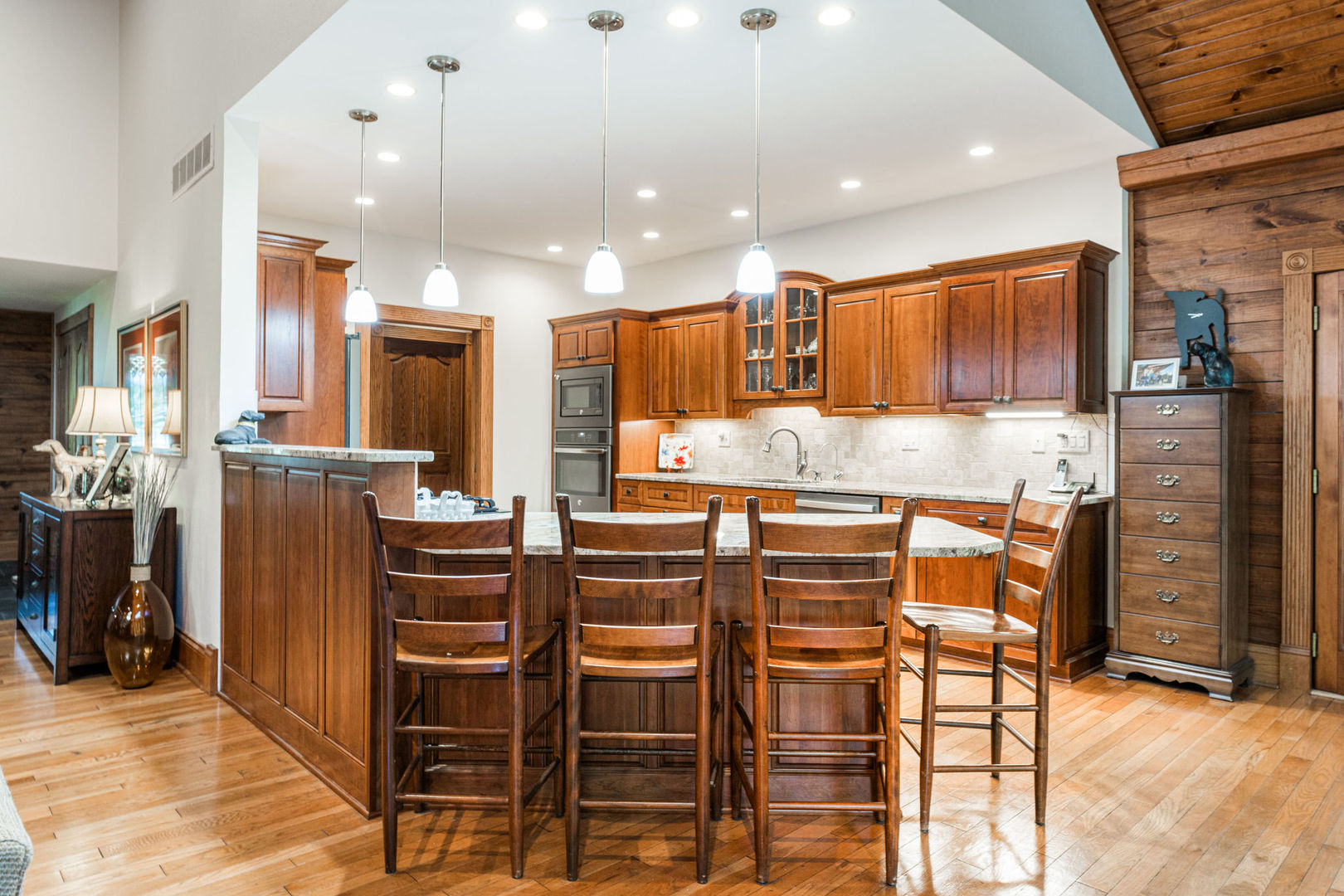 4060 Old State Road Kirkland, IL 60146 - Photo 10 of 51 a kitchen with stainless steel appliances kitchen island granite countertop a refrigerator and cabinets