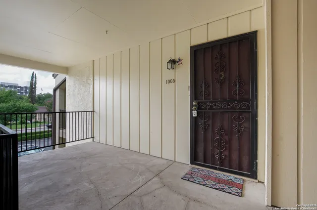a view of a house with a swimming pool and a yard
