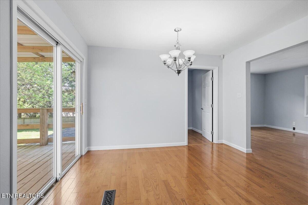 7709 Morris Road Knoxville, TN 37938 - Photo 23 of 52 a view of livingroom with hardwood floor and window