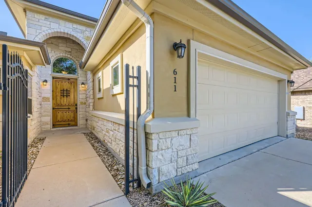 a view of a door and chair in the balcony