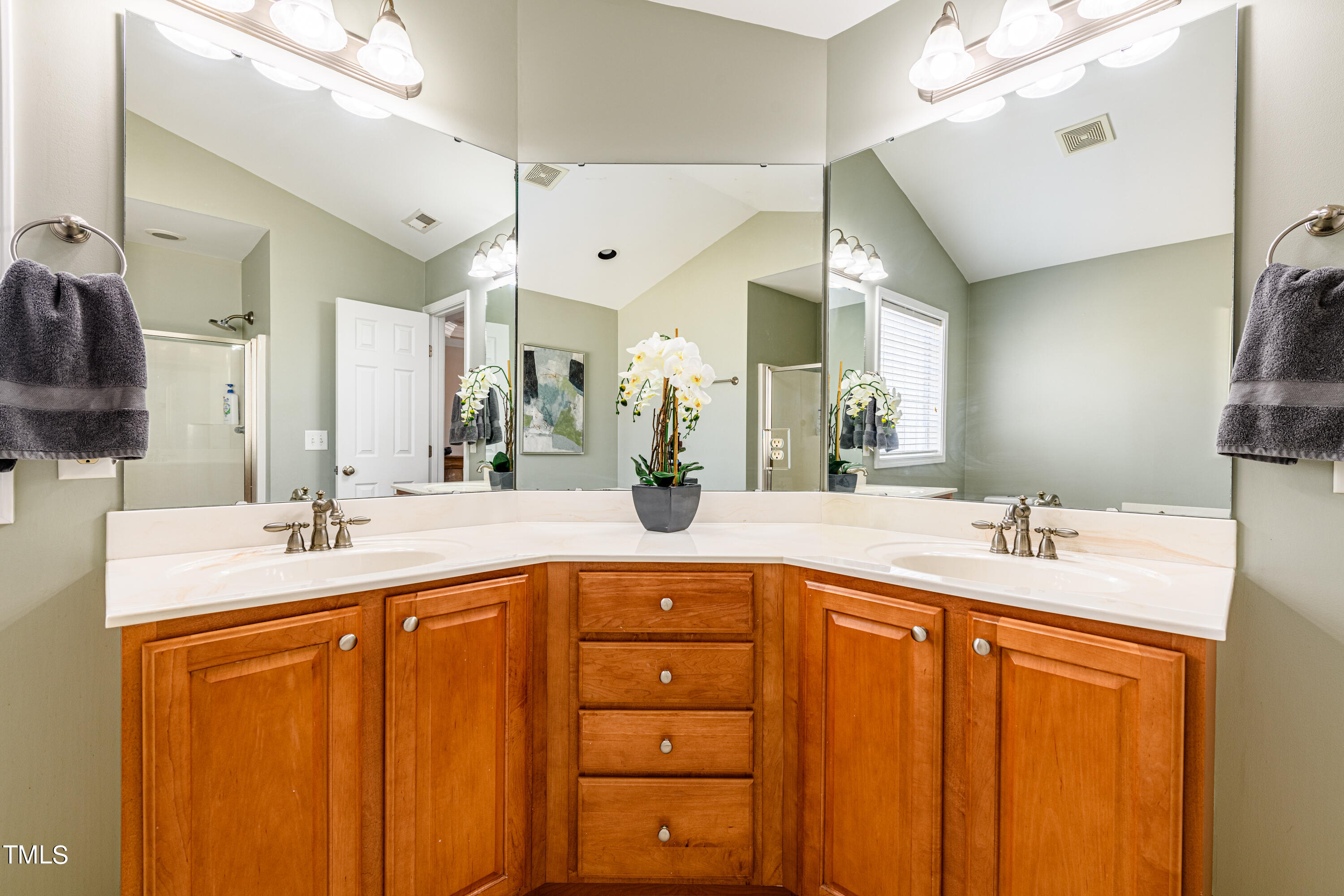 113 Sugarloaf Way Raleigh, NC 27603 - Photo 27 of 42 a bathroom with a sink double vanity and a mirror