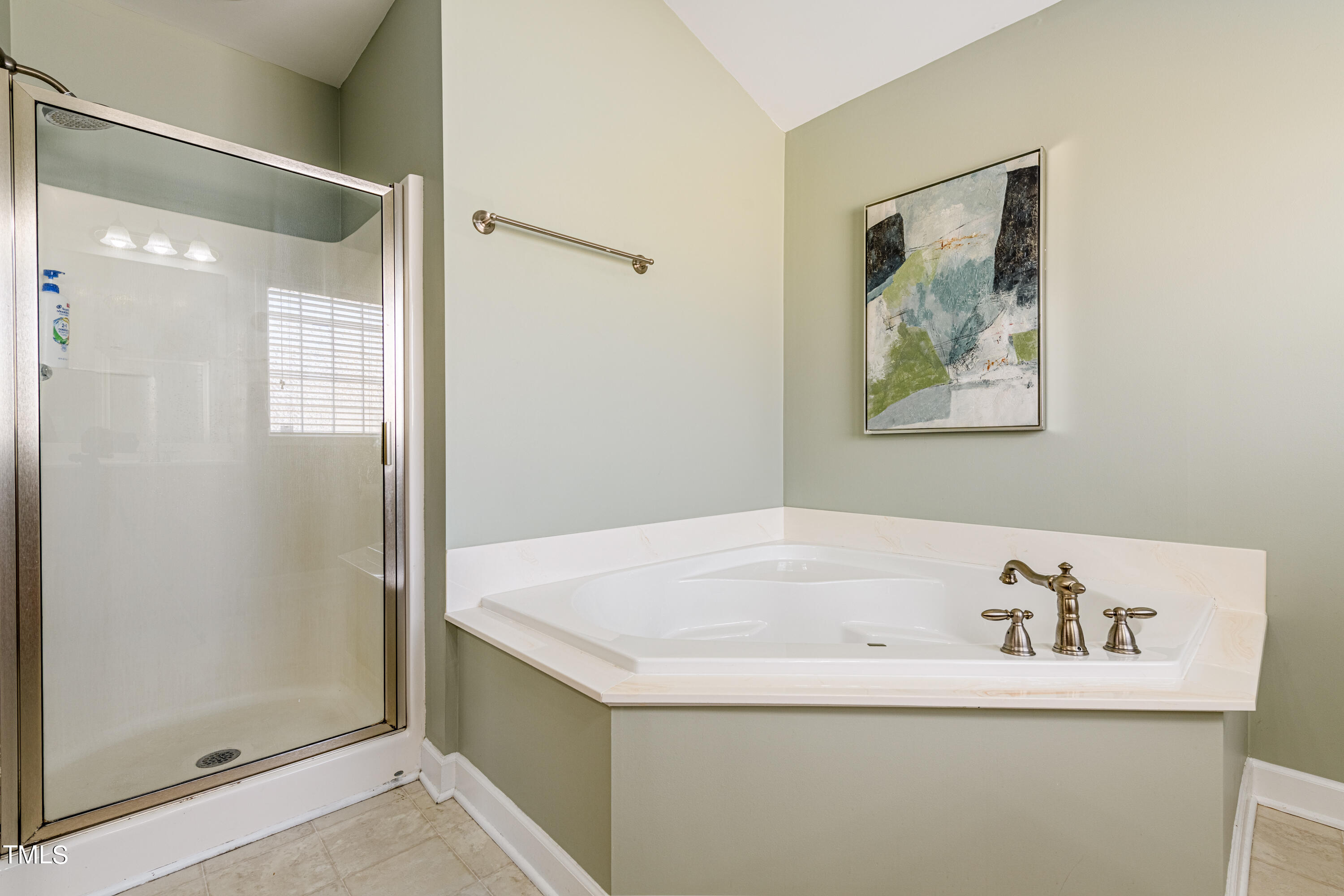 113 Sugarloaf Way Raleigh, NC 27603 - Photo 28 of 42 a bathroom with a bathtub and a shower
