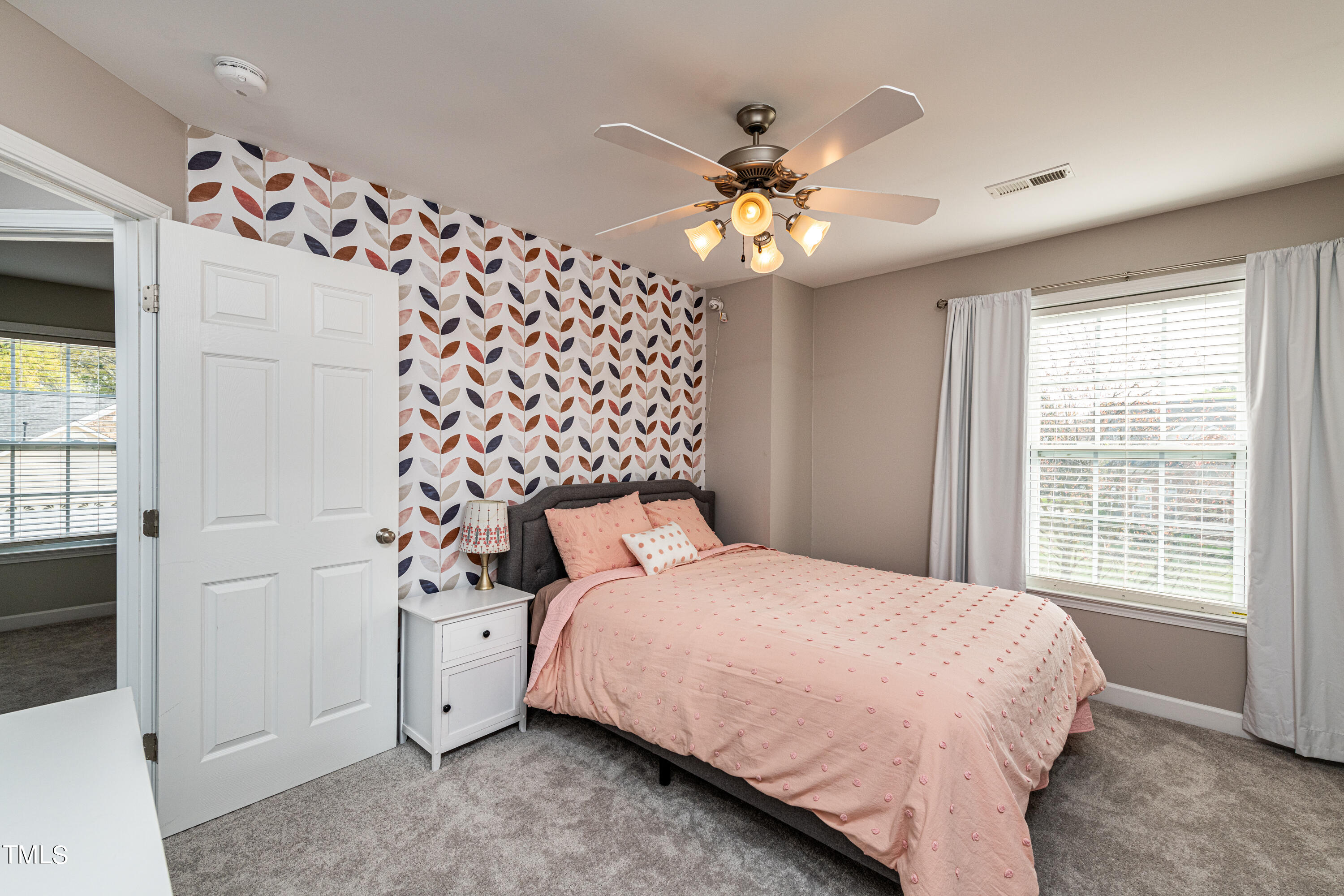 113 Sugarloaf Way Raleigh, NC 27603 - Photo 29 of 42 a bedroom with a bed and a window