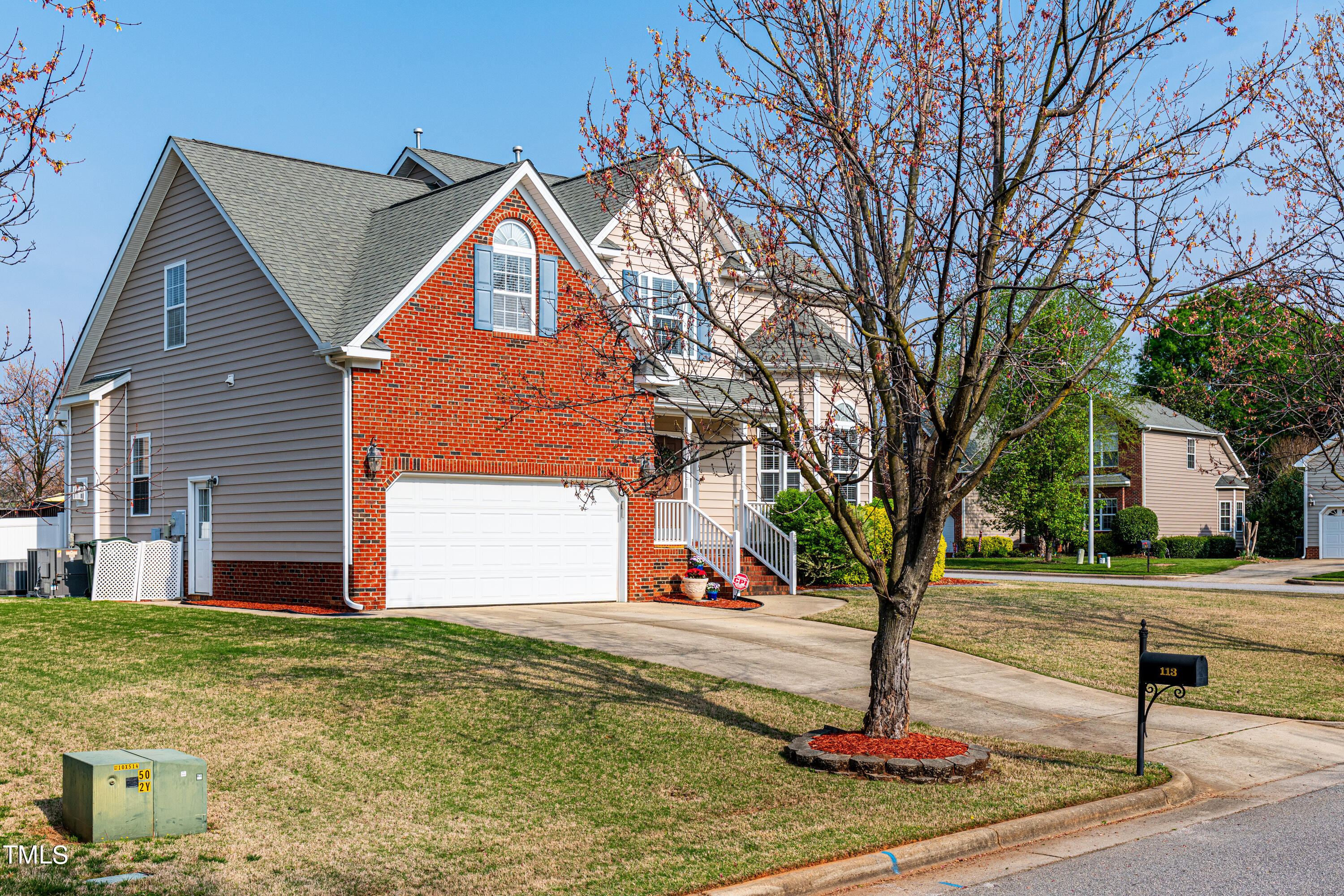 113 Sugarloaf Way Raleigh, NC 27603 - Photo 3 of 42 a front view of a house with garden
