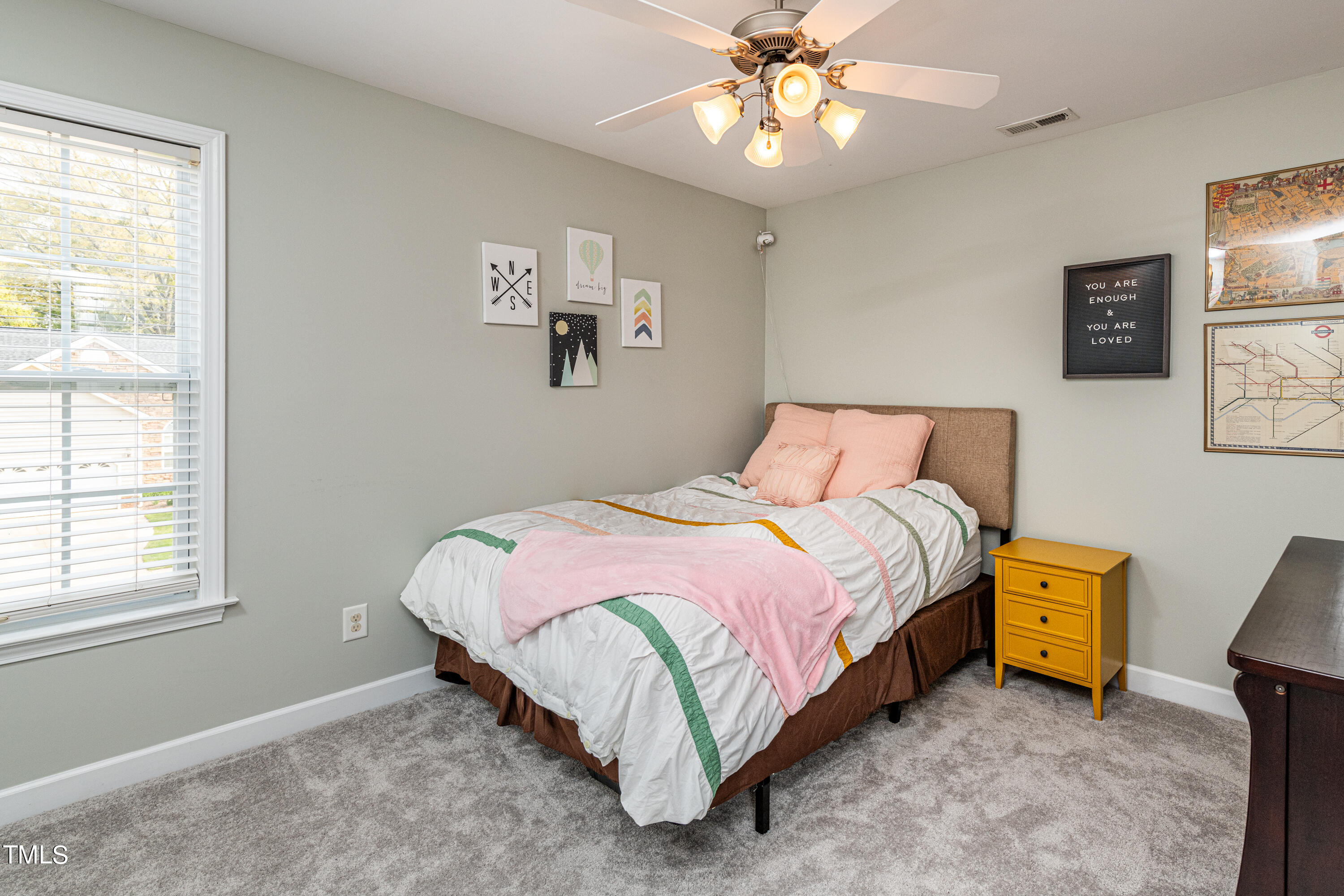 113 Sugarloaf Way Raleigh, NC 27603 - Photo 31 of 42 a bedroom with a bed and a window