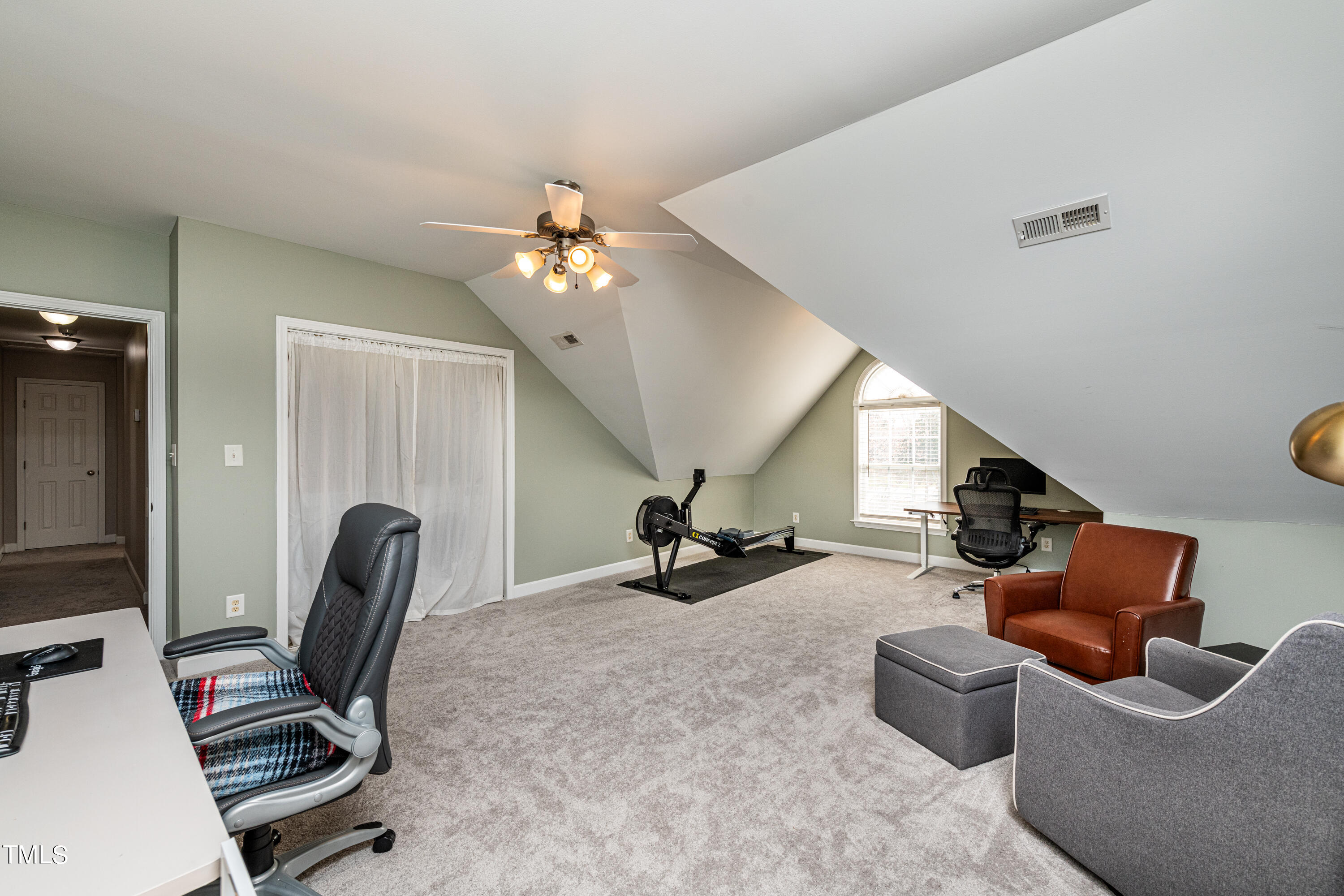 113 Sugarloaf Way Raleigh, NC 27603 - Photo 33 of 42 a view of a livingroom with couch and a workspace