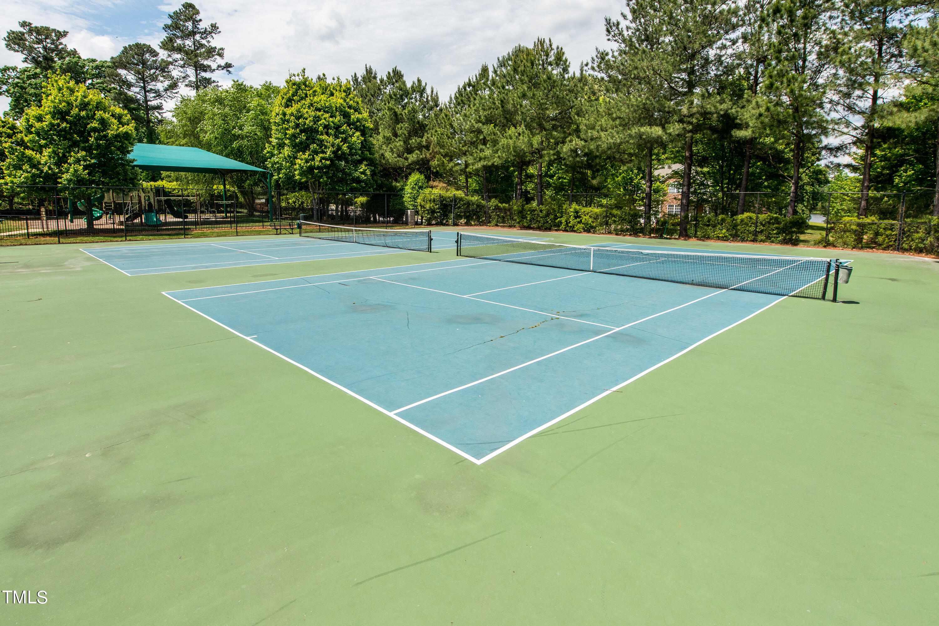 113 Sugarloaf Way Raleigh, NC 27603 - Photo 40 of 42 a view of a tennis court