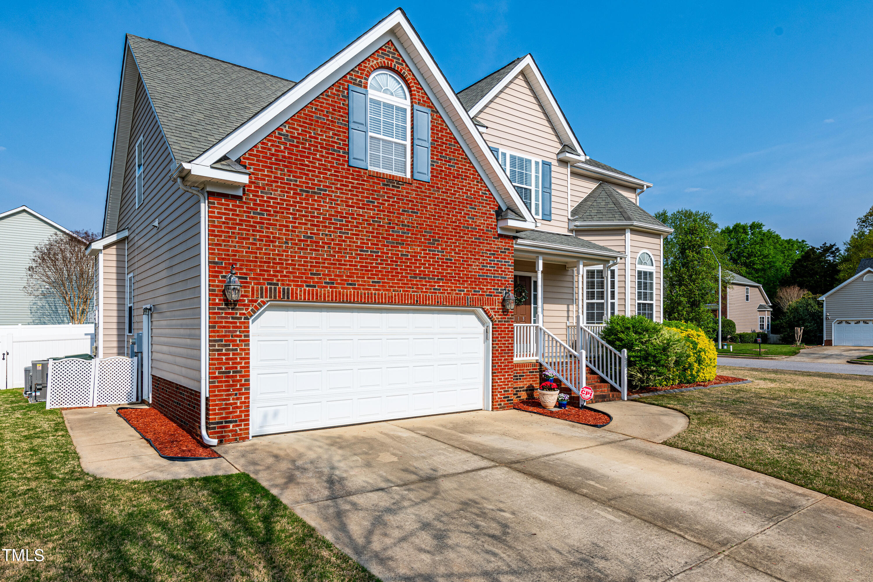 113 Sugarloaf Way Raleigh, NC 27603 - Photo 4 of 42 a front view of a house with a yard