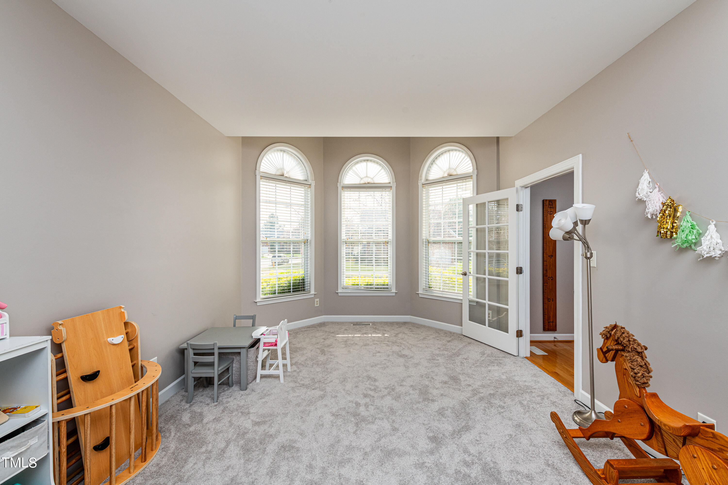 113 Sugarloaf Way Raleigh, NC 27603 - Photo 7 of 42 a living room with furniture and a window