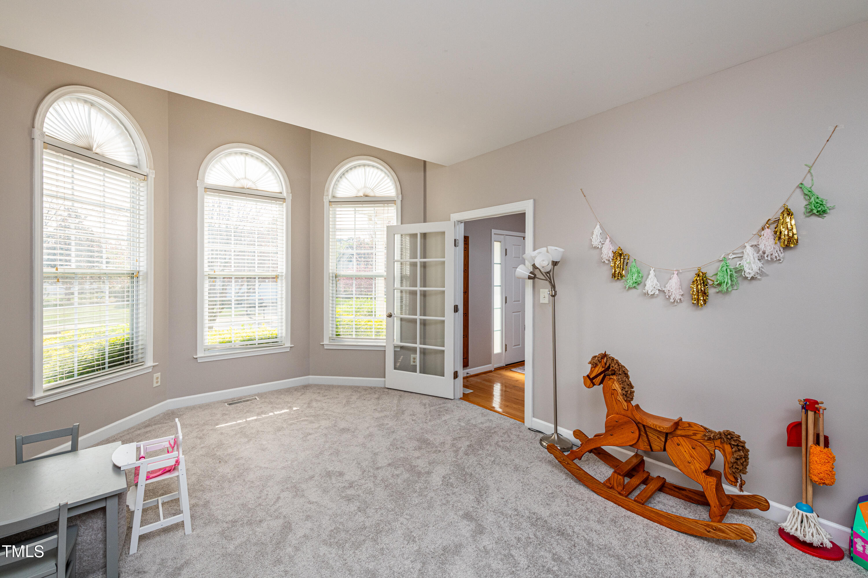 113 Sugarloaf Way Raleigh, NC 27603 - Photo 8 of 42 a view of a room with gym equipment