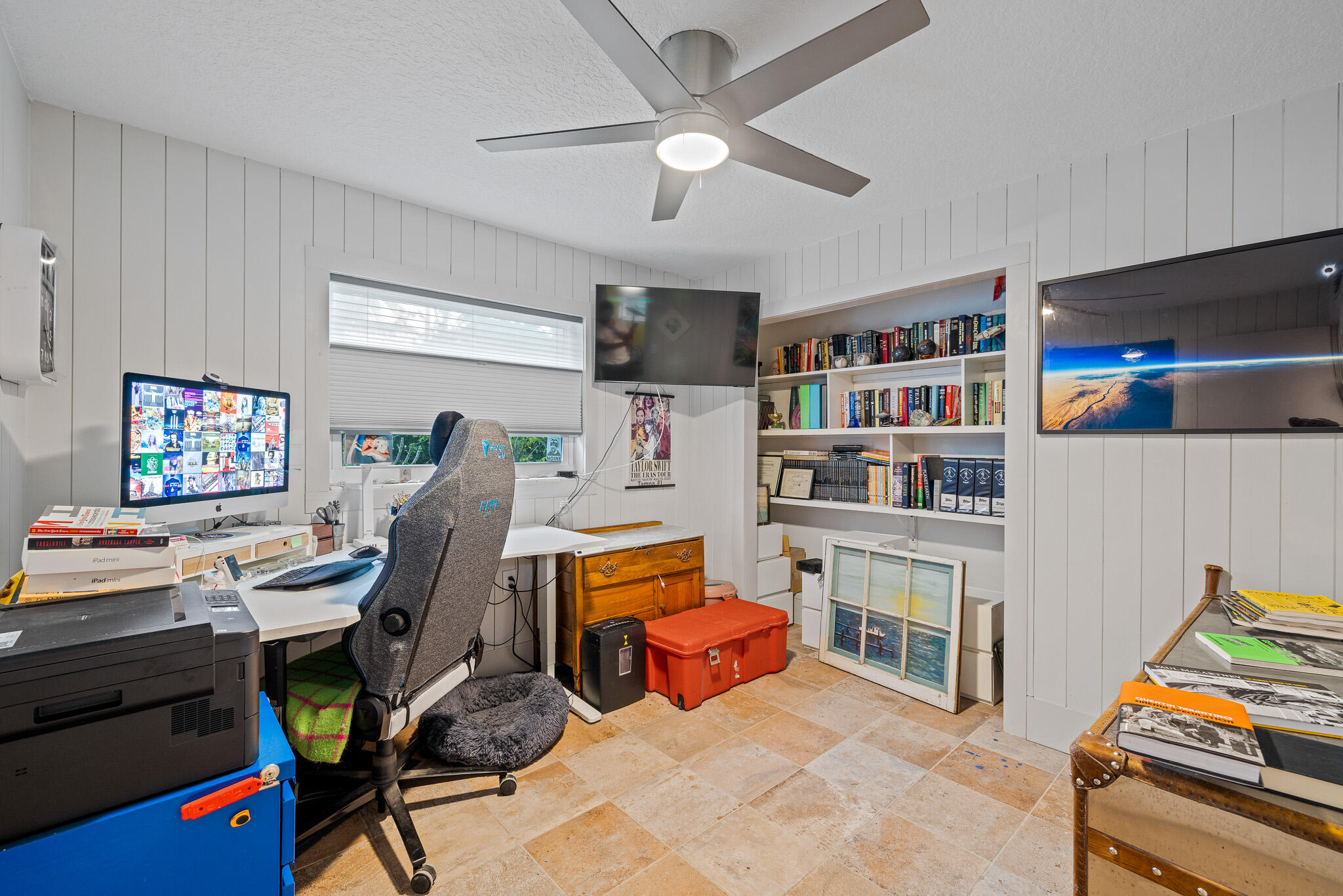 270 Richards Road Melbourne Beach, FL 32951 - Photo 16 of 41 a room with furniture a flat screen tv and a book shelf