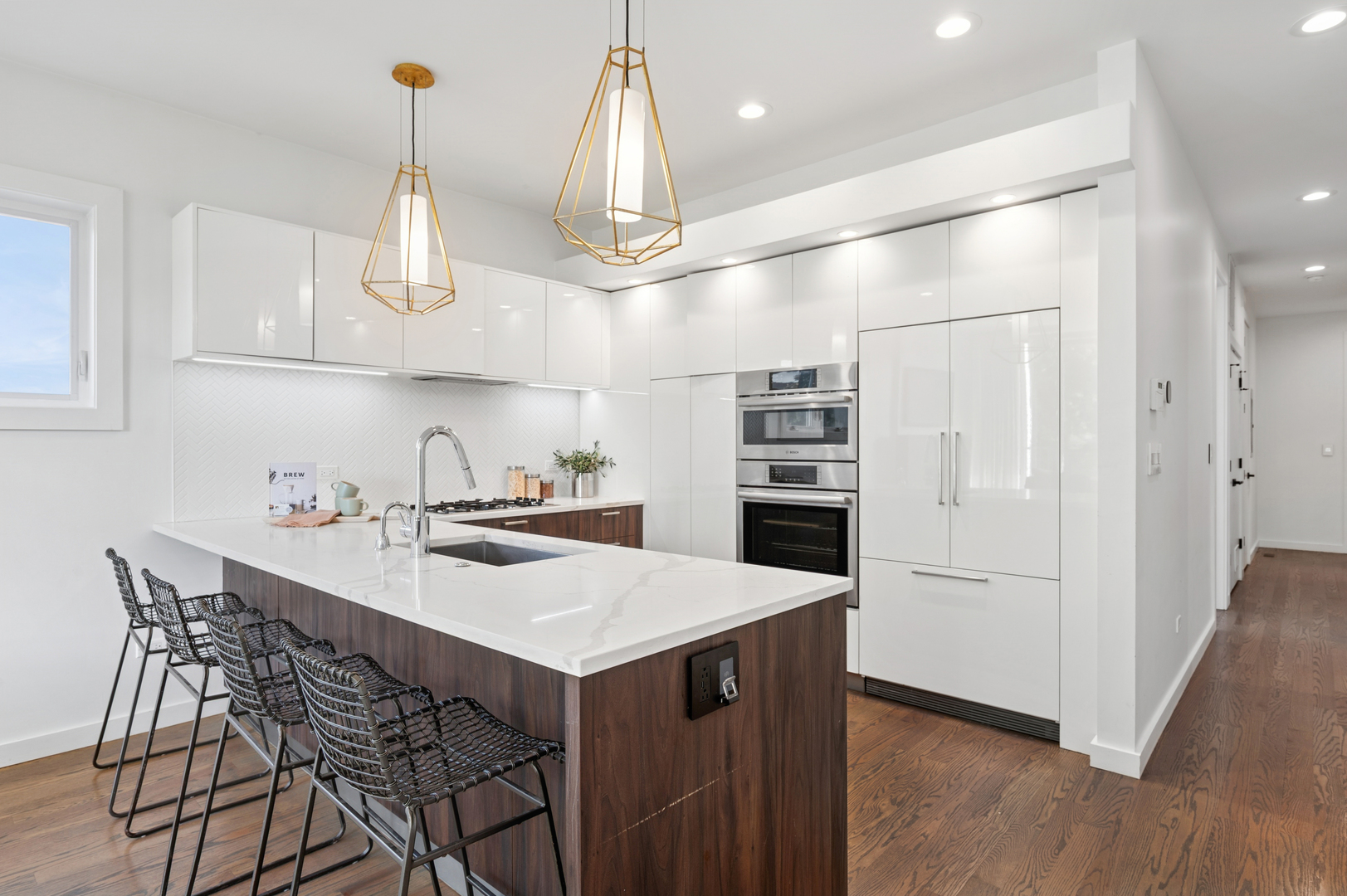 2237 North Hoyne Avenue, Unit 3N Chicago, IL 60647 - Photo 5 of 22 a kitchen with stainless steel appliances a table and chairs in it