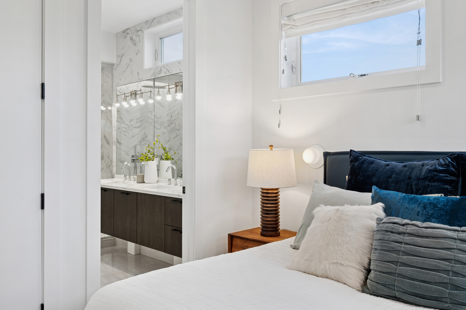 2237 North Hoyne Avenue, Unit 3N Chicago, IL 60647 - Photo 10 of 22 a bedroom with a bed and lamps