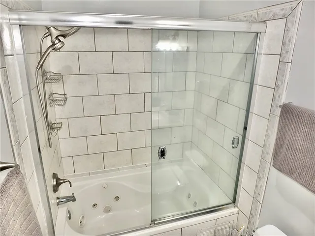 a bathroom with a sink vanity and a mirror