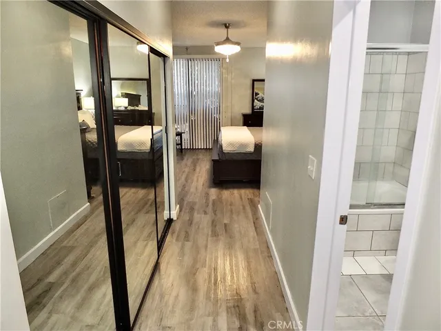 a bedroom with a bed and a dresser