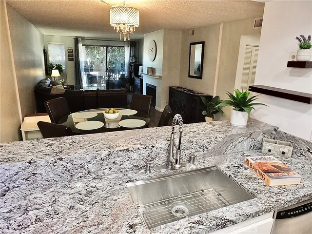 a view of a hallway with paintings on the wall